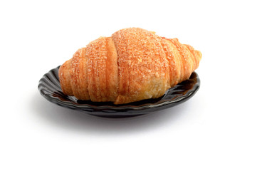 Croissant with a stuffing on a plate