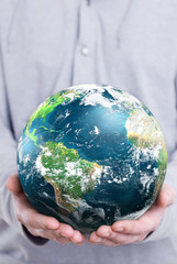 holding the planet earth in both hands