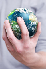 holding the planet earth