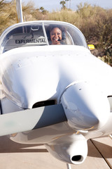 Fototapeta premium African American woman flying a private plane