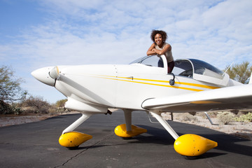 African American woman flying a private plane