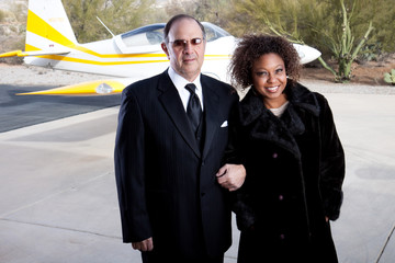 Rich couple arriving in style at the airport