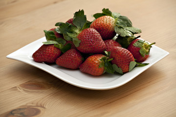 strawberries on white dish