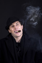 Man in black hat smoke cigar and smile