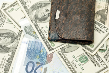 Wealth - old wallet, US dollars and euro