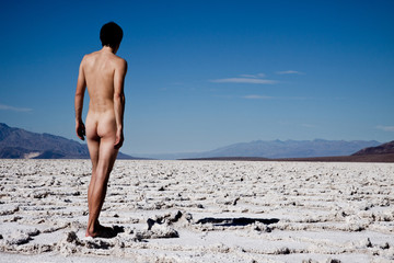 Naked man walking in Death Valley