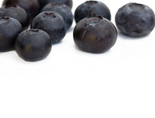 blueberries over white background with copy-space