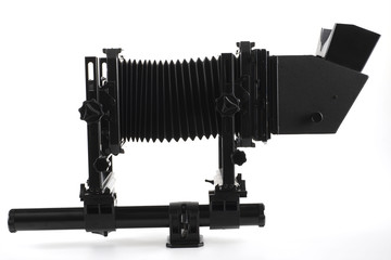 Large format camera front taken from the side.