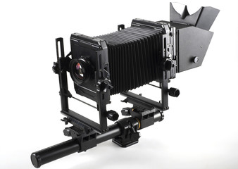Large format camera front taken from the side.