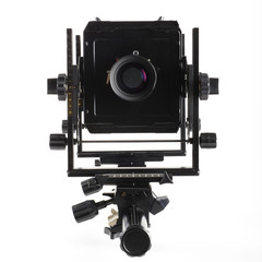 Large format camera front taken from the side.