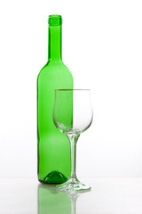 Transparent bottle of wine with glass