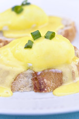 Eggs Benedict on toast with creamy hollandaise sauce.