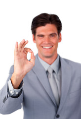 Cheerful businessman showing OK sign