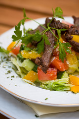 Grilled beef with vegetables closeup