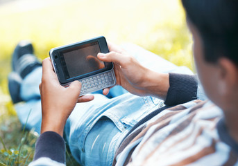 Young man with his pocket computer