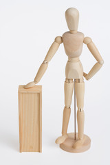 wood model leaning on wood