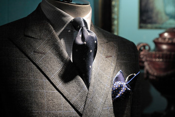 Grey checkered jacket, dark blue tie and handkerchief (vertical)