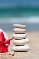 Fototapeta na wymiar Stack of stones on the beach spa
