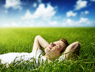 young man in grass