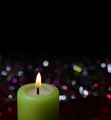 light candle on dark background