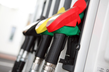 Several gasoline pump nozzles at petrol station...