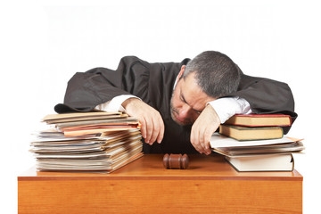 Male judge sleeping over the files