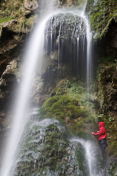Women under the Uracher Waterfall in Germany