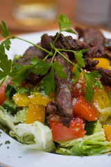 Grilled beef with vegetables closeup