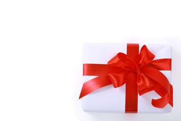 gift wrapped with a red ribbon on a white background.