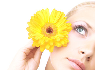 Beautiful young woman with gerber flower