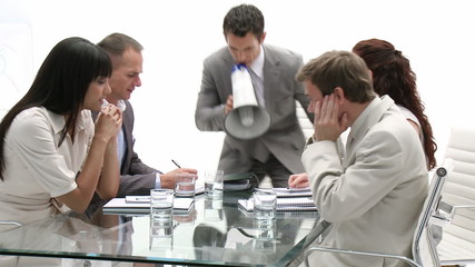 Businessman shouting through a megaphone - Powered by Adobe