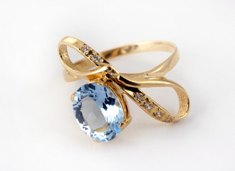 Golden ring with sapphire