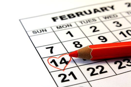 Valentine's Day calendar date with wooden pen