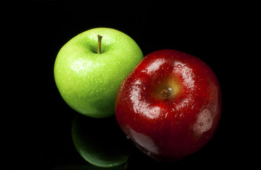 Green and Red Apples with Reflection