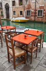 canal side cafe and canal.  Venice, Italy