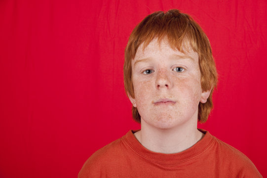 Teenage Red Headed Boy With Glum Facial Expression