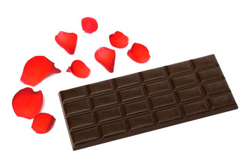 Black porous chocolate with rose petals isolated on white