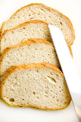 Bread and knife conceptual image.