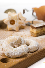 vanilla croissants and other cookies on wooden background