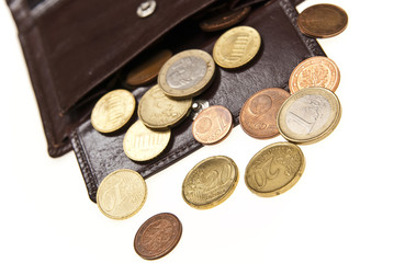 brown leather wallet and coins