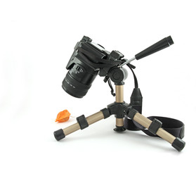 Modern digital camera on a mini tripod