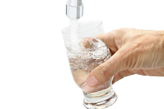 glass of water under the tap
