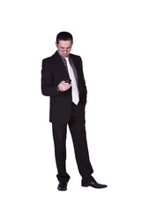 Obraz na płótnie Canvas Businessman Texting On His Cell Phone
