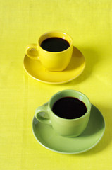 Yellow and green cups of coffee