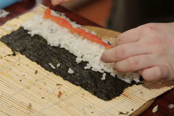 Cook making sushi