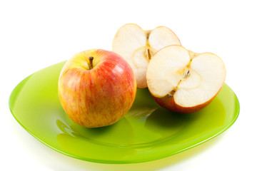 Apples on green plate