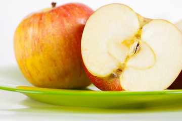 Apples on green plate