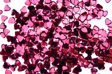 Heart shaped confetti on white background