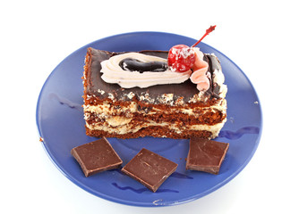 Chocolate cake with  cream and cherry