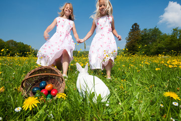 Easter bunny watching the egg hunt
